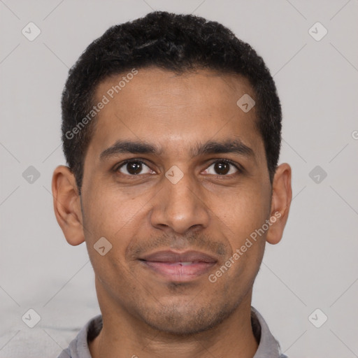 Joyful latino young-adult male with short  brown hair and brown eyes