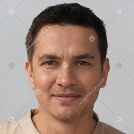 Joyful white adult male with short  brown hair and brown eyes