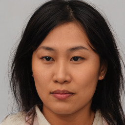 Neutral asian young-adult female with medium  brown hair and brown eyes