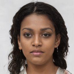 Neutral black young-adult female with long  brown hair and brown eyes