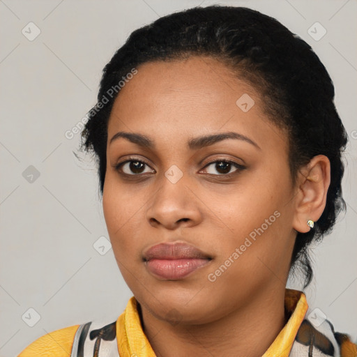 Joyful latino young-adult female with short  black hair and brown eyes