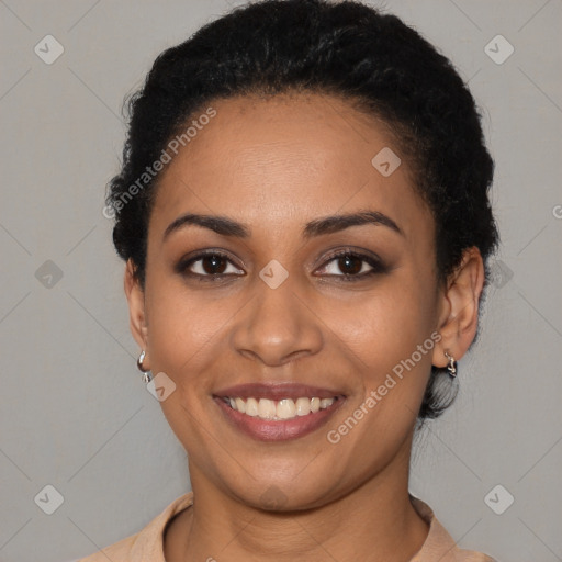 Joyful latino young-adult female with short  black hair and brown eyes