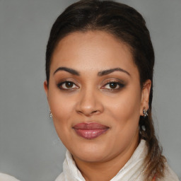 Joyful latino young-adult female with medium  brown hair and brown eyes