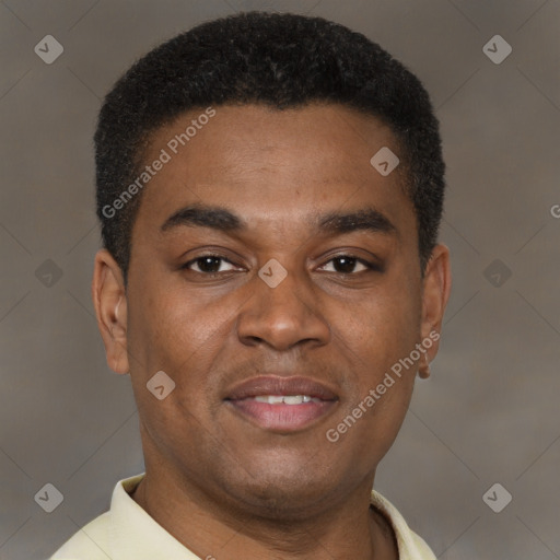 Joyful latino young-adult male with short  brown hair and brown eyes