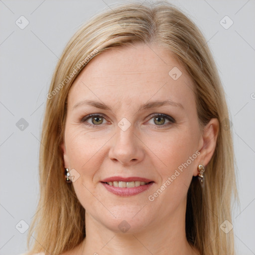 Joyful white adult female with long  brown hair and brown eyes