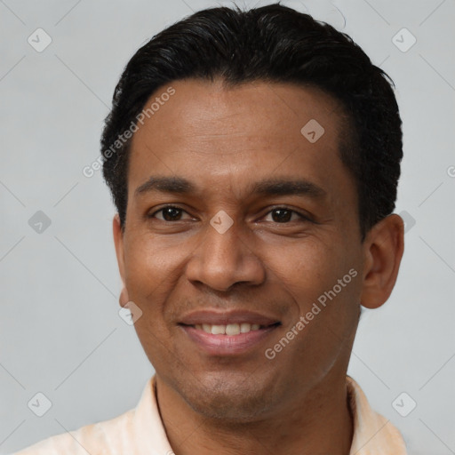 Joyful latino young-adult male with short  black hair and brown eyes