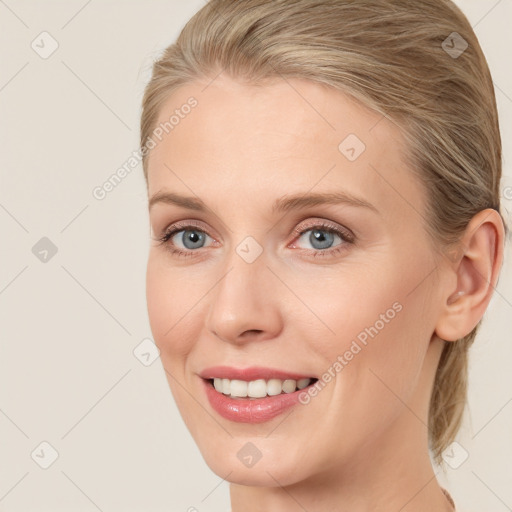 Joyful white young-adult female with medium  brown hair and blue eyes