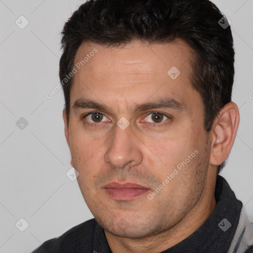 Joyful white adult male with short  brown hair and brown eyes