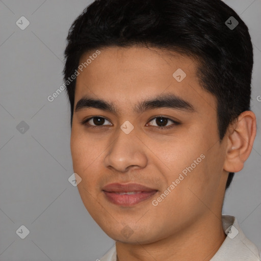 Joyful asian young-adult male with short  black hair and brown eyes