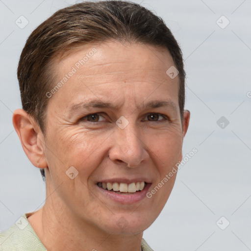 Joyful white adult female with short  brown hair and grey eyes