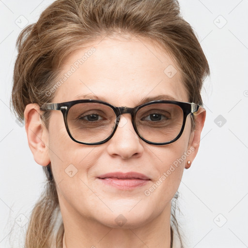 Joyful white adult female with medium  brown hair and blue eyes