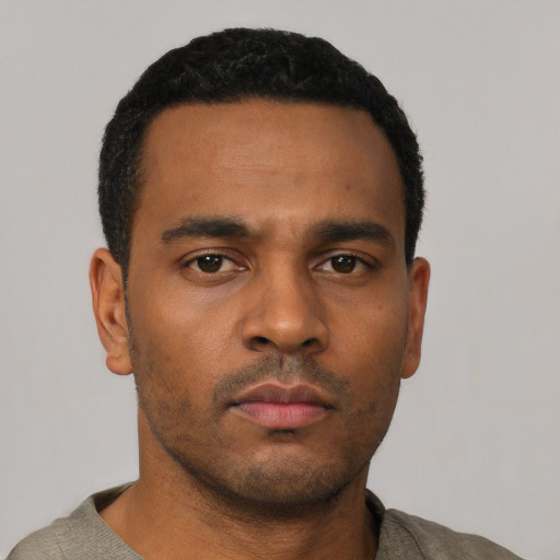 Neutral black young-adult male with short  black hair and brown eyes