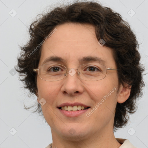 Joyful white adult female with medium  brown hair and green eyes