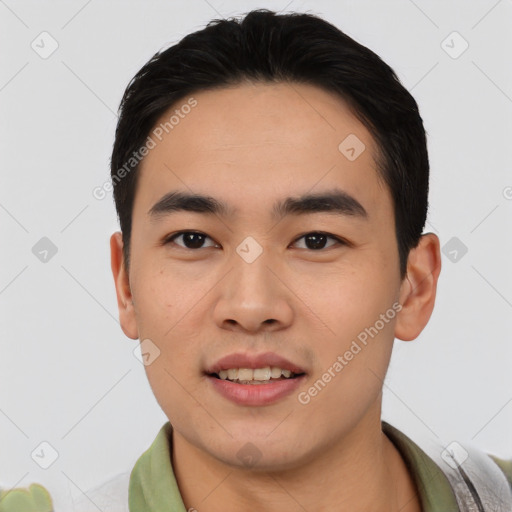 Joyful asian young-adult male with short  black hair and brown eyes