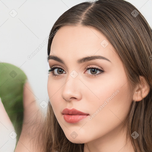 Neutral white young-adult female with long  brown hair and brown eyes