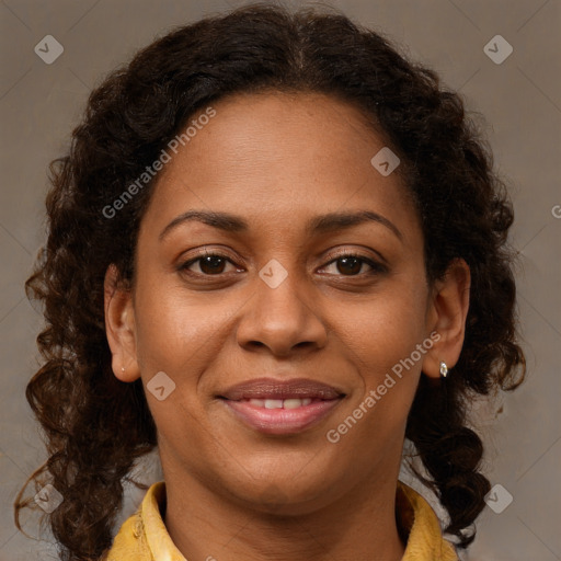 Joyful black young-adult female with long  brown hair and brown eyes