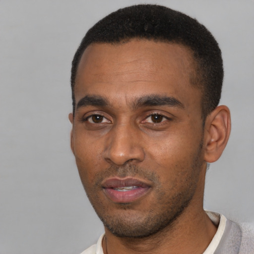 Neutral latino young-adult male with short  black hair and brown eyes