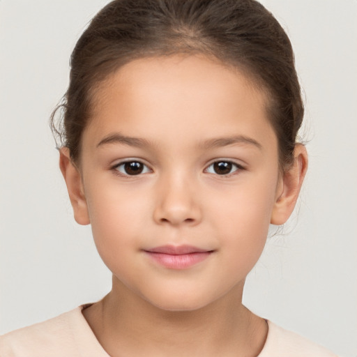 Joyful white child female with short  brown hair and brown eyes