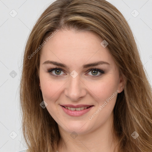 Joyful white young-adult female with long  brown hair and green eyes