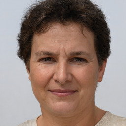 Joyful white adult female with short  brown hair and brown eyes