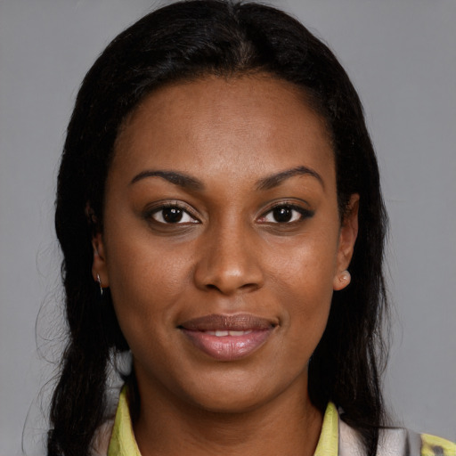Joyful black young-adult female with medium  brown hair and brown eyes
