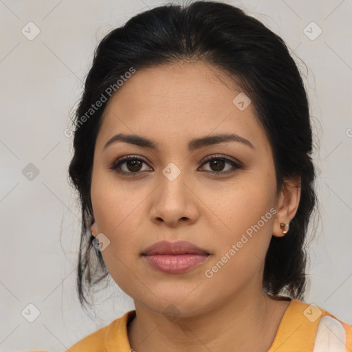 Joyful latino young-adult female with medium  brown hair and brown eyes