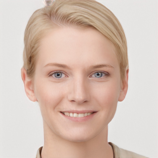 Joyful white young-adult female with short  brown hair and blue eyes