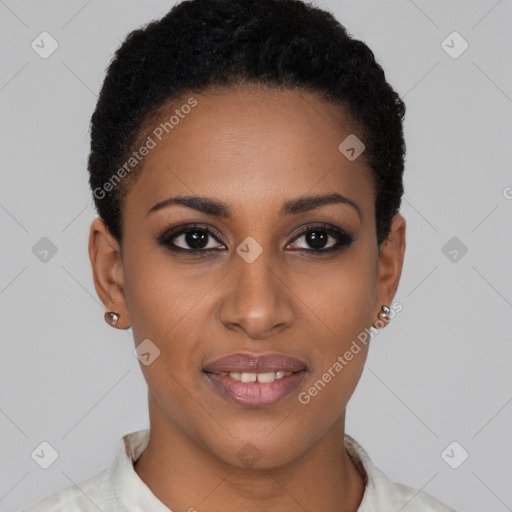 Joyful black young-adult female with short  black hair and brown eyes