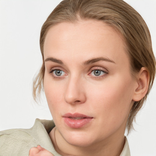 Neutral white young-adult female with medium  brown hair and blue eyes