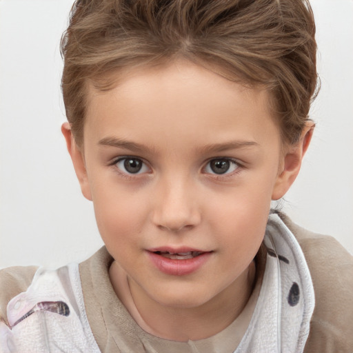 Joyful white child female with short  brown hair and brown eyes