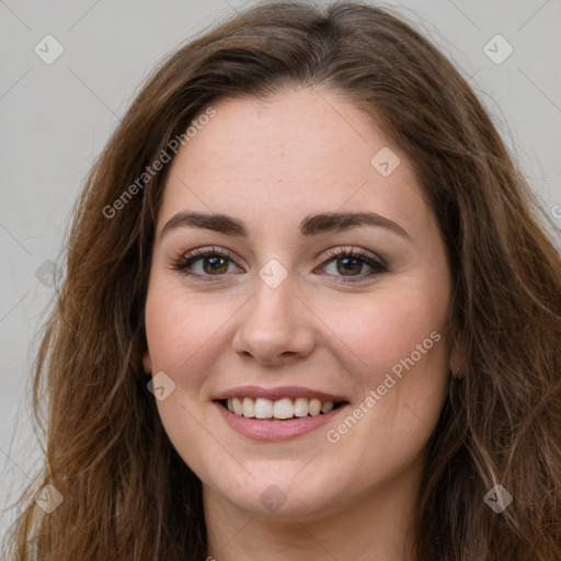 Joyful white young-adult female with long  brown hair and green eyes