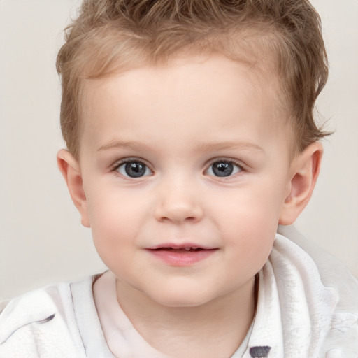 Joyful white child male with short  brown hair and brown eyes