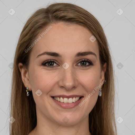 Joyful white young-adult female with long  brown hair and green eyes