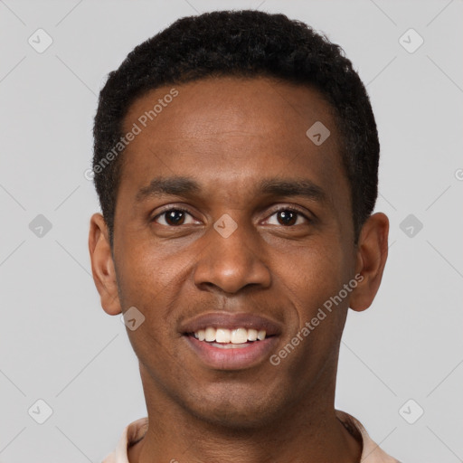 Joyful black young-adult male with short  black hair and brown eyes