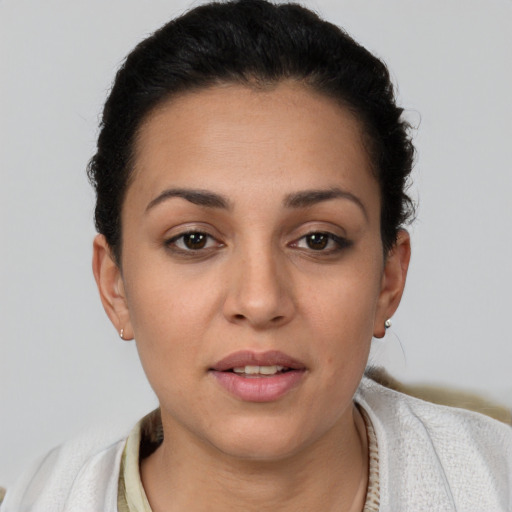 Joyful white young-adult female with short  brown hair and brown eyes