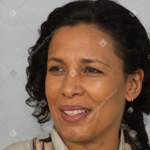 Joyful latino adult female with long  brown hair and brown eyes