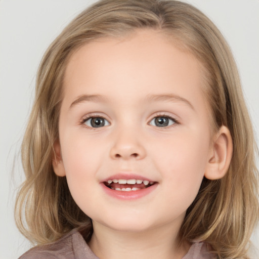 Joyful white child female with medium  brown hair and brown eyes