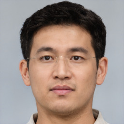 Neutral asian young-adult male with short  brown hair and brown eyes