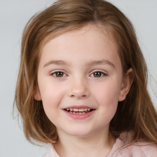 Joyful white child female with medium  brown hair and blue eyes