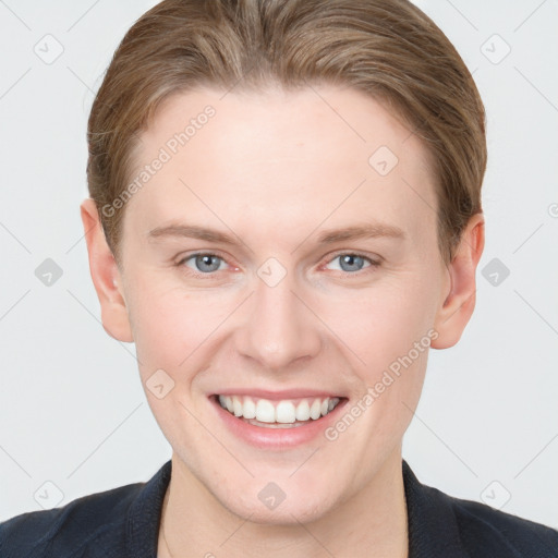 Joyful white young-adult female with short  brown hair and blue eyes