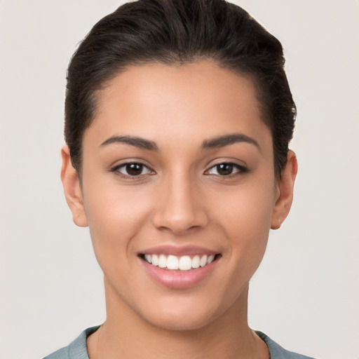 Joyful white young-adult female with short  brown hair and brown eyes