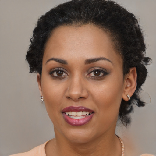 Joyful latino young-adult female with short  brown hair and brown eyes