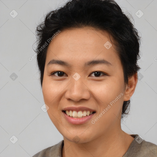 Joyful asian young-adult female with short  brown hair and brown eyes