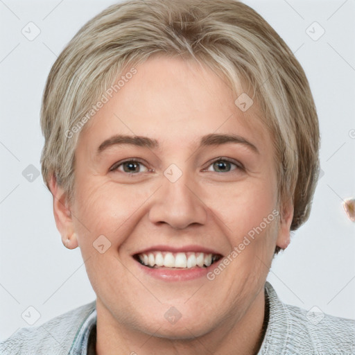 Joyful white young-adult female with short  brown hair and blue eyes