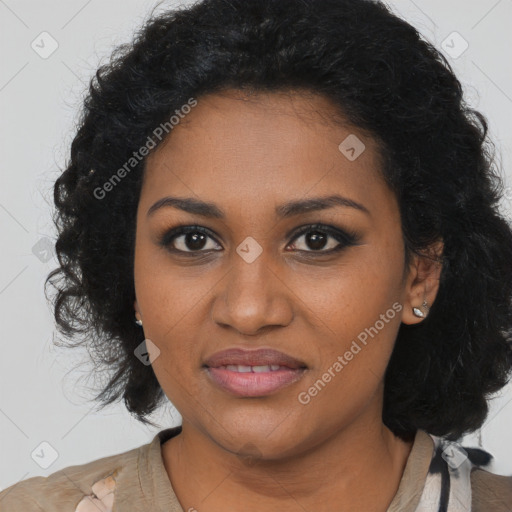 Joyful black young-adult female with long  black hair and brown eyes