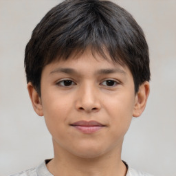 Joyful white child male with short  brown hair and brown eyes