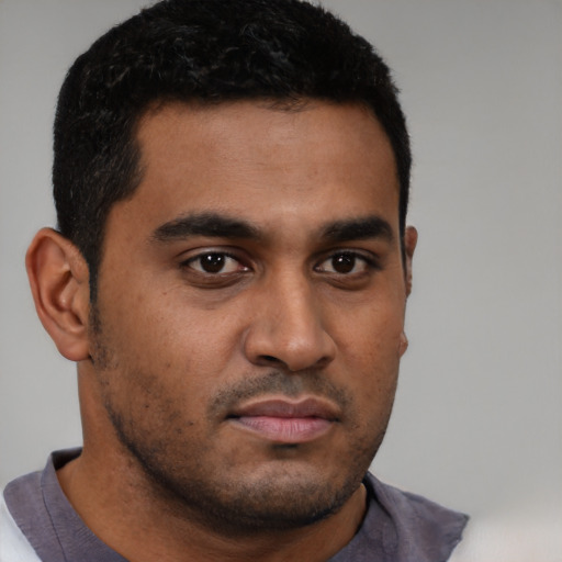 Neutral black young-adult male with short  brown hair and brown eyes
