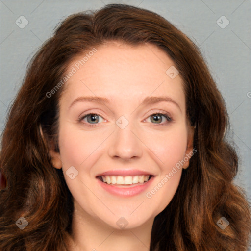 Joyful white young-adult female with long  brown hair and blue eyes