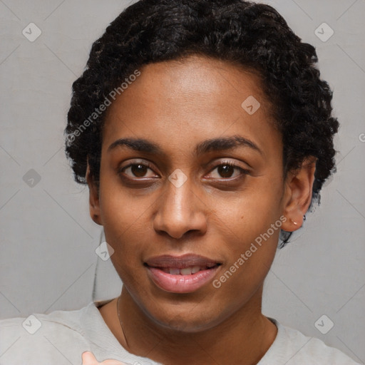 Joyful black young-adult female with short  black hair and brown eyes