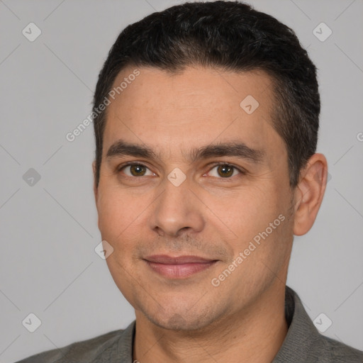 Joyful white young-adult male with short  black hair and brown eyes